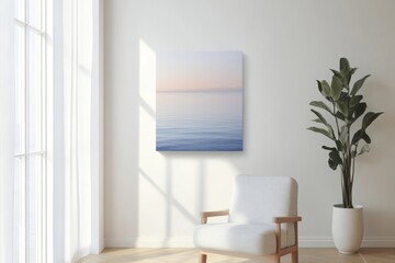 A serene minimalist living space featuring a modern armchair, ocean-themed artwork, and a potted plant by a sunlit window.