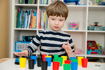 Color cap game. Sorting, counting, building. Children activities. Logical tasks for kids. Concentration and attention, patience, Montessori methodology. pursuit of the goal, strategy, new challenge.
