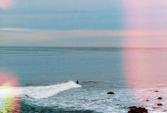 Waves Crashing Against the Shore with Subtle Light Leaks