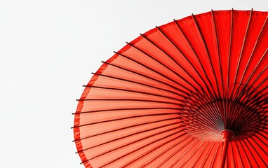 Vibrant red umbrella with a sleek design, isolated on a bright white background