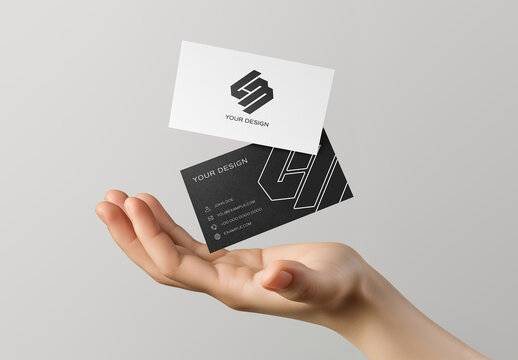 2 Textured Business Card Floating Above A Hand Mockup