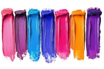 Vibrant colors of paint swatches arranged in a row showcasing a spectrum from pink to orange in a creative workspace