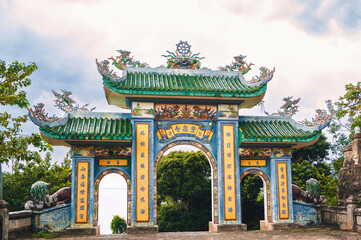 Beautiful Gate of Linh ung Pagoda with blue sky at Chua Linh Ung Bai But Temple, Da Nang, Vietnam.