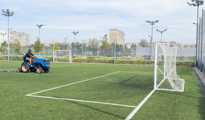  soccer field and worker in field © Angelov