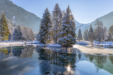 Frozen lake in the pretty French Alpine village of Les Contamines-Montjoie