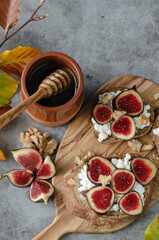 A plate of fruit with a wooden board and a jar of honey. Scene is warm and inviting, with the honey and fruit creating a sense of comfort and indulgence