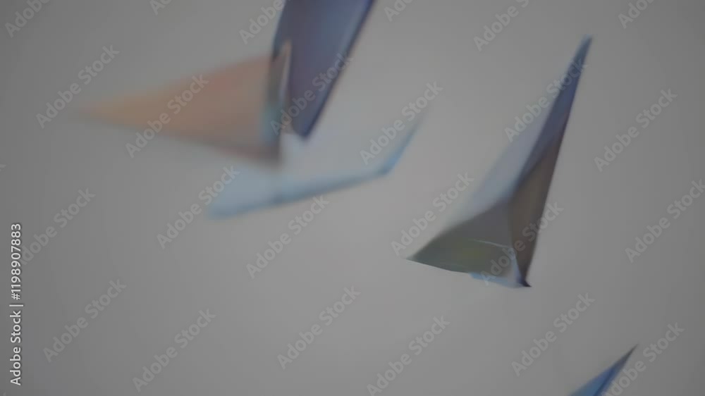 Poster triangular prism with rainbow light refractions on a gray background, surrounded by smaller geometri