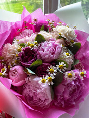 Bouquet of peony flowers in delicate shades of pink, vertical image