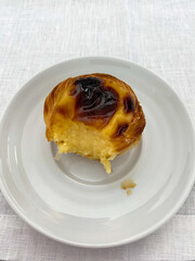 Vertical picture, Portuguese sweet Pastel de nata, a dessert with custard