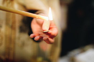 burning match in hand