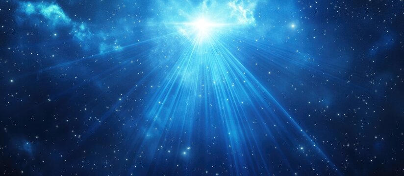 Bright blue cosmic background with rays of light emanating from a central source in a starry night sky Copy Space