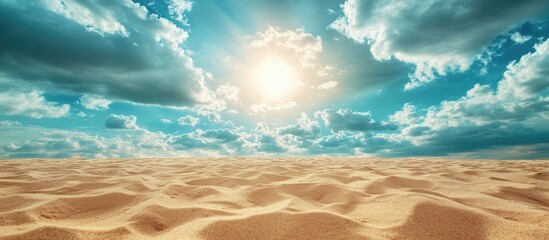 Obraz premium Desert landscape with undulating sandy terrain and dramatic clouds illuminated by bright sun. Copy Space.