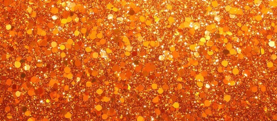 Abstract orange glitter background with shimmering particles and Copy Space for text placement