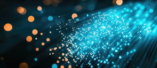 Abstract blue and orange light particles on a dark background with Copy Space for text insertion