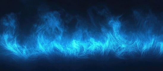 Obraz premium Blue flames on a dark background with swirling motion and texture suitable for abstract or digital design elements Copy Space