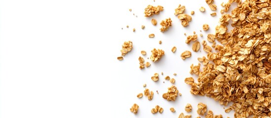Granola flakes scattered on white background with copy space for text placement