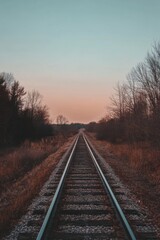 Fototapeta premium Tranquil Railroad Tracks at Sunset: A Journey's Promise