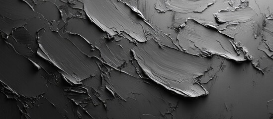 Textured abstract background with gray paint strokes on a dark surface featuring subtle depth and dimension, ideal for Copy Space.
