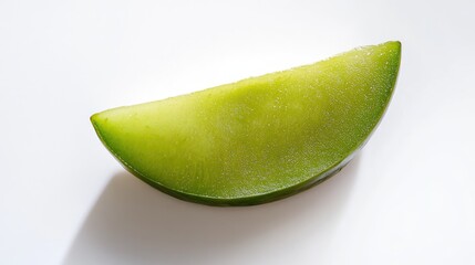 Sliced green apple segment on a white background with bright lighting and copy space for text placement