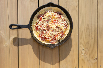 Pan fried pizza ready to cook