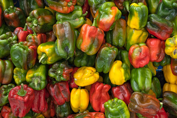 Close up of a pile of paprika peppers in a farmers market