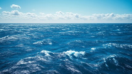 Obraz premium Ocean Waves Under a Blue Sky with White Clouds