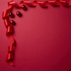 Red ribbon lay on the corner on red background, element for design with copy space for text or image
