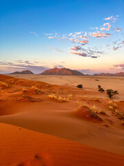 Dramatic sunset in the desert with clouds and intense sky 