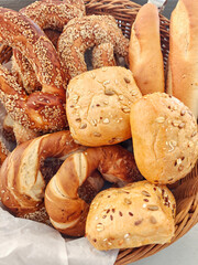 Sesame buns, bagels, and other breads on cafe stand