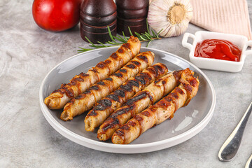 Grilled meat sausages wrapped bacon