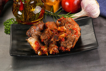 Baked beef ribs with vegetables