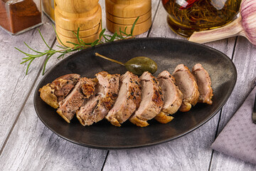 Roasted duck breast slices in the plate