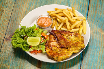 Grilled chicken fillet with french fried potato