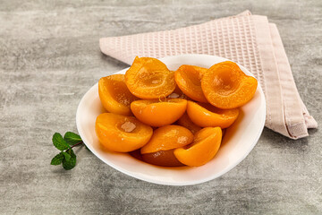 Sweet canned apricots with syrope