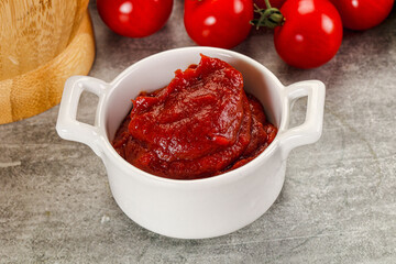 Red tomato paste in the bowl