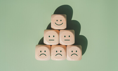 World mental health day concept or feedback rating and positive customer review, wood cube stacking...