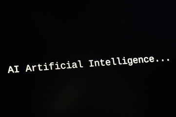 Black computer screen, with the text AI Artificial Intelligence. Use and evolution of artificial intelligence.