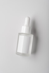 Minimalist glass dropper bottle with blank label for mock-up