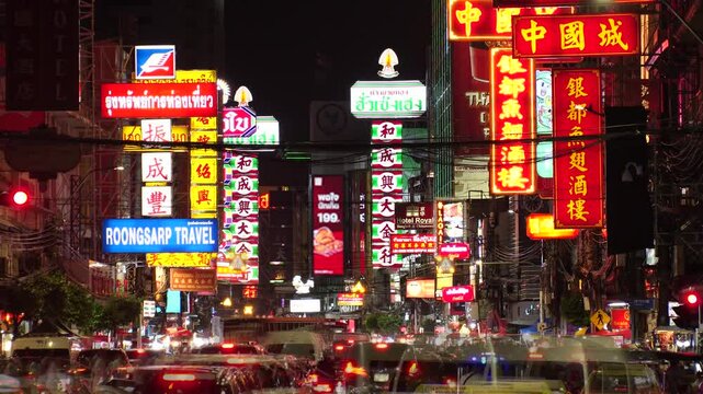 BANGKOK, THAILAND - AUGUST 2024 : View of China town Yaowarat road. Time lapse shot at night.