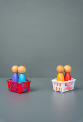 Figures of people in shopping baskets. Concept of consumer baskets, prices, assortment and consumer...