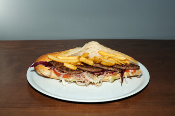 Beef steak and fries sandwich retro flash food photography.