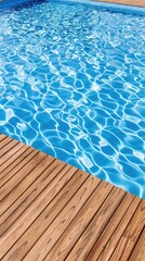 Obraz premium Beneath the bright sun, a stunning swimming pool sparkles with blue water, framed by a warm wooden deck. This serene environment offers ample space for creating memories or sharing messages