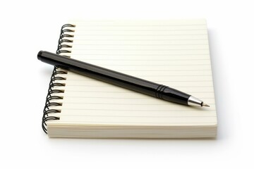 Black pen is lying on top of a blank spiral notepad, suggesting the potential for writing or note taking
