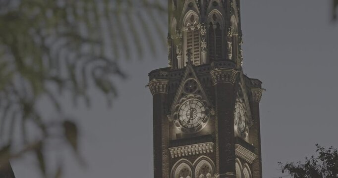 Close-up view on Rajabai Clock Tower In Evening Illumination Ungraded C LOG 2. Clock Tower In Mumbai India. Confines Of Fort Campus Of University Of Mumbai. It Stands At Height Of 85 M or 280 Ft
