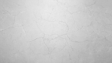A grey wall with a grey background. The wall is made of concrete and has a rough texture