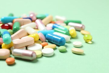 Various pills on color background