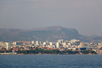 Contemporary buildings, gardens and beaches at the waterfront in Split, Croatia. View of Split from the boat.