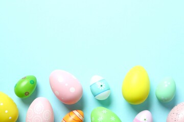 Happy Easter card. Easter eggs on color background, top view