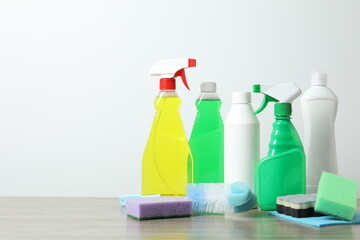 Many different house cleaning products on the table