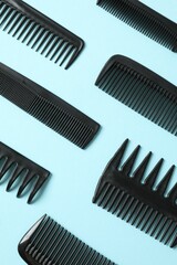 Professional combs and hairdresser tools on color background, top view